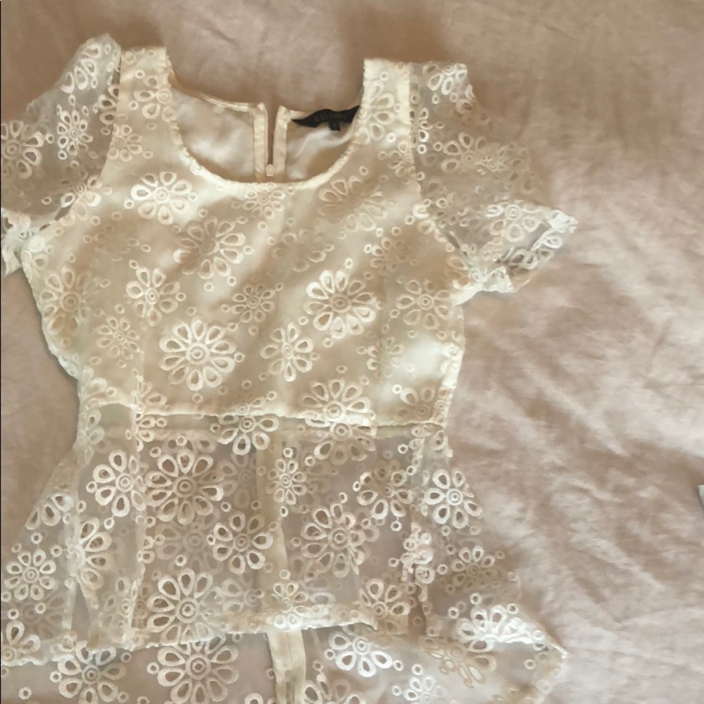 Beautiful white peplum cutout top